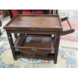 Well made dark wood serving trolley in dark wood. Excellent condition. H:25 x W:20 x D:29 inches.