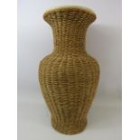 Large floor vase with rattan surround approx 21" tall.
