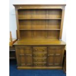 Mid Oak Coloured Ercol Dresser with plate rack above. H:74 x W:57 x D:21 Inches. Very good conditio