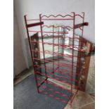 Wall mounted coated wire wine rack. 41 Inches tall. See photos. S2