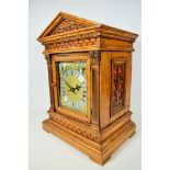 Beautiful and large Oak cased mantle clock with brass face. Opening doors with side vents, Westminst