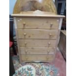 Solid pine Bedroom five drawer chest. Made in bleached weather effect pine with carved decorations.