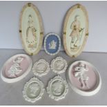 Selection of plaster wall plaques.