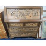 Interesting Oriental style Bureau with carved detail to drawers. Raised on bracket feet it measures