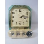 Seiko quartz westminster whittington wall clock with date window and a retro flip desk top clock