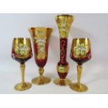 Selection Bohemian red glass vases and glasses gilt and enamel decorated.