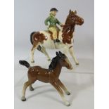 Beswick Skewbald pony and girl rider model no 1499 plus beswick foal. Both have had repair see