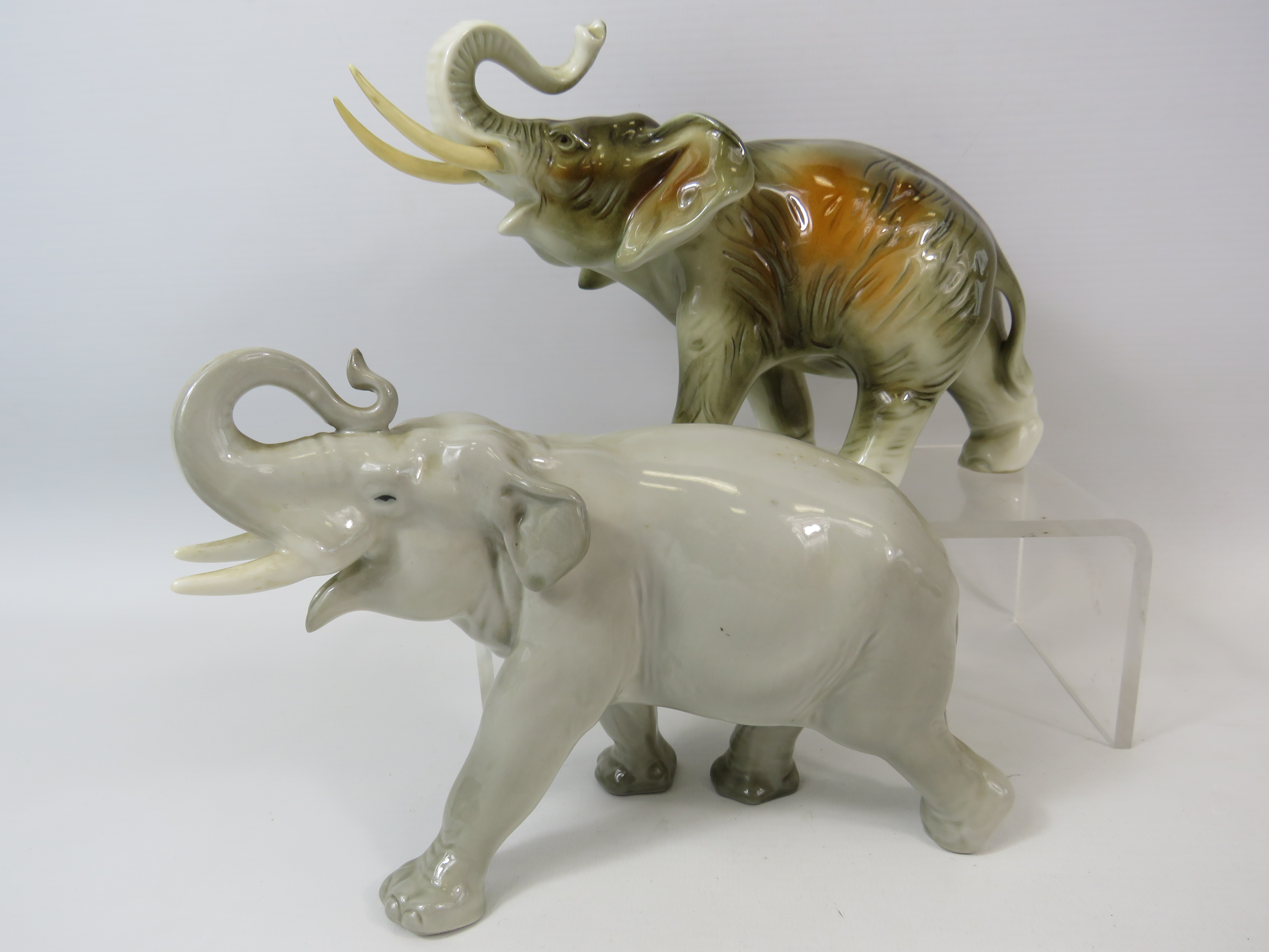 One Dux and One Lomonosov Elephant figurines.