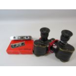 A pair of Crown optical company usa military stereo 6 x 30 binoculars and a pair of pocket