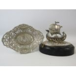 Silverplated model viking boat on a wooden base and a french embossed bonbon dish.