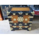 Chinese inspired two drawer cabinet with three hidden drawers. Exposed metal brightwork and side han