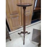 Attractive Mahogany Jardinaire stand with circular top. Measures 43 inches tall on three bracket fee