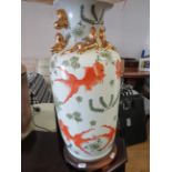 Oriental vase style table lamp on a circular wooden base ,..22 Inches tall. See photos. S2