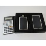 Casio fx 580 scientific calculator and a hip flask set.