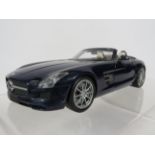 Minichamps 1:18 Scale Model of a 2011 Mercedes Benz AMG Roadster with original box and packaging. E