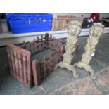Vintage cast iron fire grate and a pair of brass lion fire dogs.