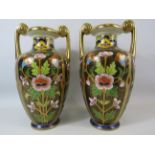 Pair of twin handled Noritake vases with gilt and floral decoration, approx 11.5" tall.