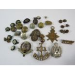 WW1 1914-15 Star medal and a selection of cap badges, lapel badges, pips and buttons.