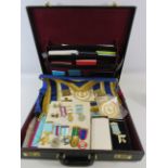 Brief case containing 9 Masonic Medals, aprons, cufflinks, books etc.