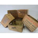 Selection of vintage wooden advertising crates.