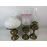 Three classic Brass & Glass Oil lamps, all have clear glass chimneys, two with opaque glass shades.