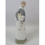 Lladro Figurine of a Girl holding a Goat, approx 11" Tall.