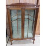 Early 20th Century (1930's) Glass display cabinet with glazed front locking doors and sides. Raised