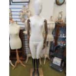 Vintage Clothing display dummy standing on beechwood base with articulated wooden arms and hands. M