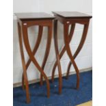 Matched pair of highly unususal tall occasional tables or plant stands. Each measures 40 inches ta