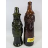 2 Vintage glass beer bottles in the form of a man and a nun.
