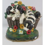 Large Cast iron door stop of puppies in a basket, 13" tall and 13.5" wide.