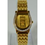 Brooks and Bentley gents watch 'Sport of Kings' Ingot watch. Face is 99.9 Gold. Gold tone strap. St