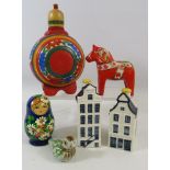 Mixed lot to include a Olsson Swedish horse, a set of russian dolls, Klm Bols houses etc.