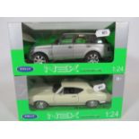 Two Welly Nex 1:24 Scale Die Cast -Models of a Chevrolet Chevelle & Land Rover, Range Rover. Both wi