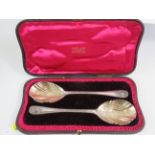 Beautful matched pair of ceremonial spoons in original retailers silk and velvet lined Case. Each s