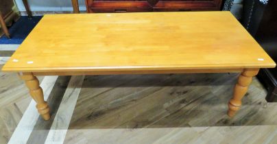Nicely made blonde wood table with turned legs and scarf jointed top. H:17 x W:50 x D:24 Inches, see