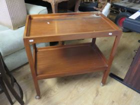 Mid to late 20th Century teak serving trolley with shelf under. Rides smoothly on original castors.
