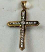 9ct Yellow gold crucifix pendant set with multiple CZ stones. 30mm long. 2.5g overall.