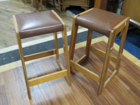 Matched pair of Oak Stools, each with Stiched leather seat. Each measures 24 inches tall. See phot