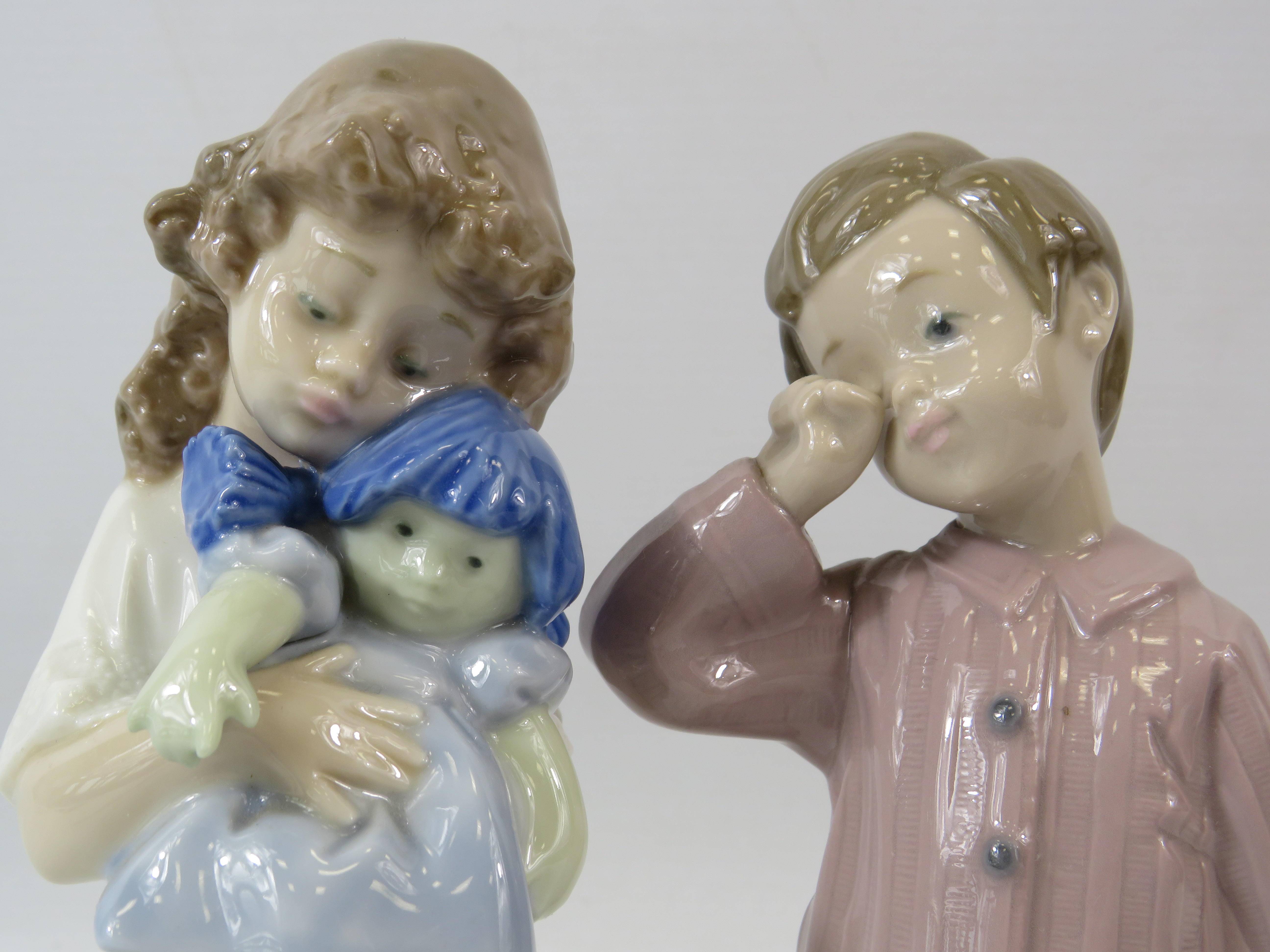 2 Nao Lladro figurines, a girl with a doll and a boy with a teddy the tallest measures 8". - Image 2 of 4