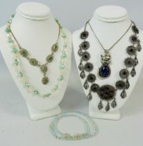 Selection of very pretty pendant necklaces with silver clasps. See photos.