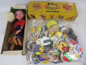 Pelham 'Twizzle' Puppet in playworn condition in original box plus a selection of metal pin badges.
