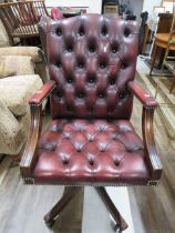 Lovely Dark Brown Chesterfield style button backed office or study chair. Height adjustable and set