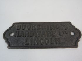 Duckerings Hardware Lincoln small cast iron sign.