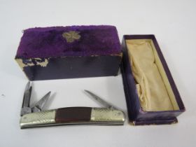Vintage sheffield penknife with vintage velor topped box.