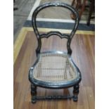 Victorian childs chair in ebonised oak with Mother of pearl inlaid embelishments,  Bergere seat.  Se