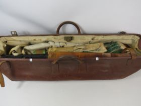 Vintage leather cricket bag containing two bats, pair of pads, gloves, box. See photos.