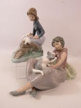 2 Nao Lladro figurines, a girl with 3 rabbits and a girl with a kitten. The tallest measure 6 3/4"