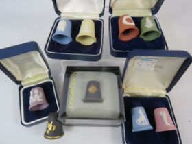 9 Wedwood jasperware christmas thimbles, various colours.