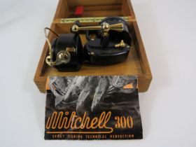 Mitchell 300 Fishing reel in wooden storage box.